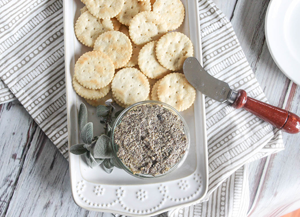 an overhead view of vegan mushroom pate on a plate with crackers 