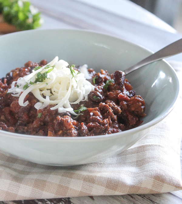 a bowl of hearty chili with a spoon