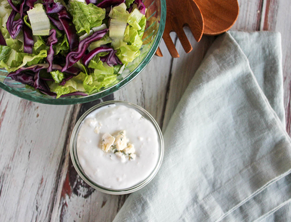 an overhead view of blue cheese dressing with a salad