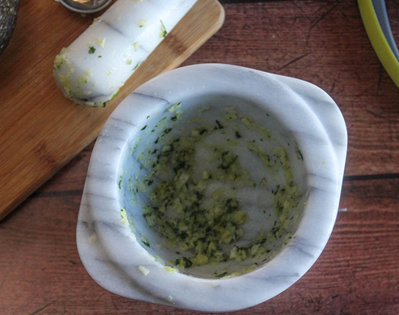 garlic onions and cilantro samshed in bowl