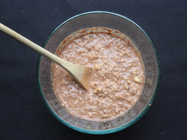 banana chocolate overnight oats mixed together in a bowl