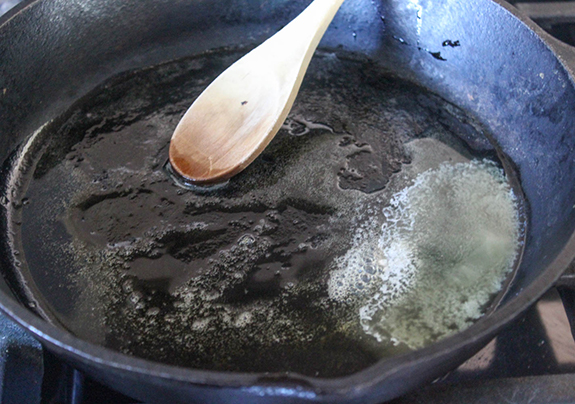 a photo of butter melted in a skillet