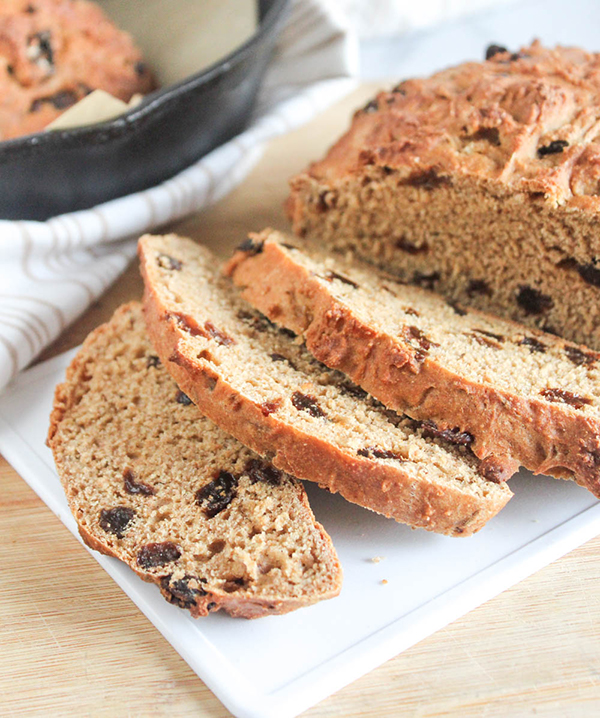 sliced whole wheat irish soda bread on a cutting board