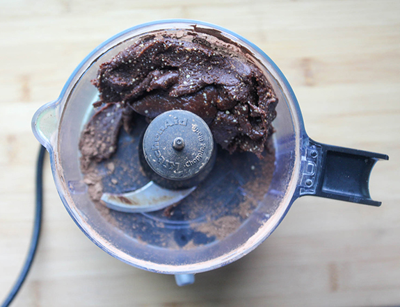 peanut bites ingredients blended into a dough in a food processor