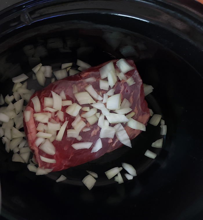 beef brisket in a crock pot withonions