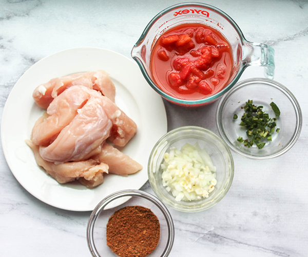 The ingredients: chicken, tomatoes, chili powder, onions, jalapeno pepper chopped