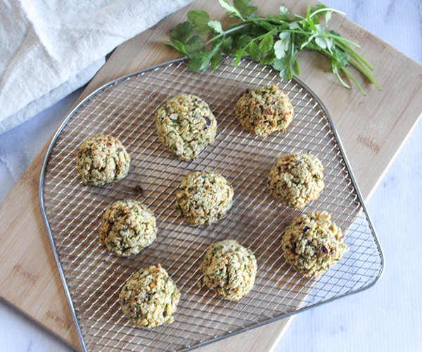 cooked falafel on an air fryer tray