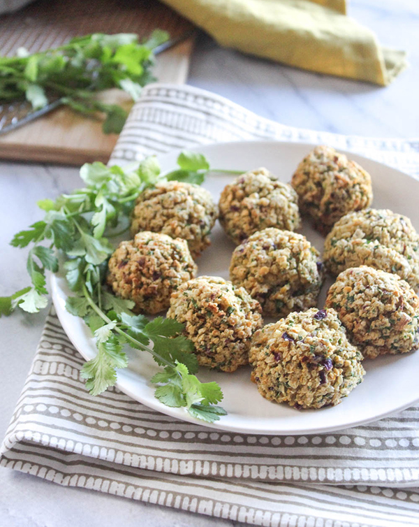 falafel on a white plate with cilantro