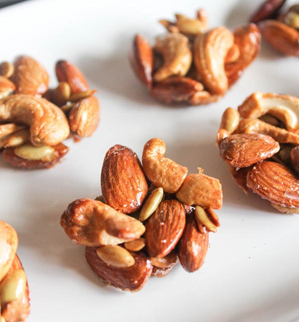 cashew clusters on a white tray close up