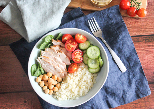 overhead view of rice bowl on top of a blue napkin