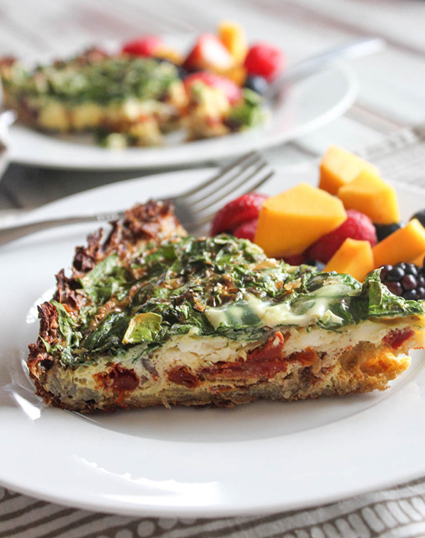 a slice of quiche on a plate