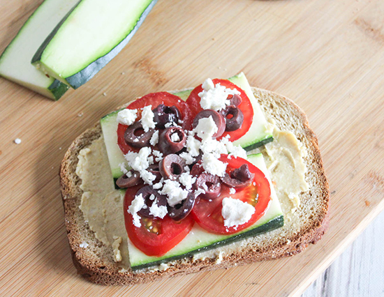 olives and cheese on top of tomatoes