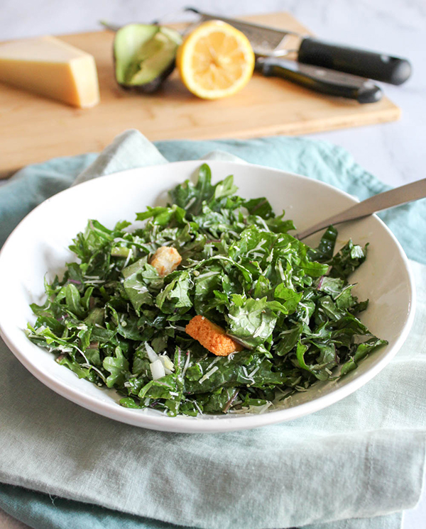 a bowl filled with kale salad