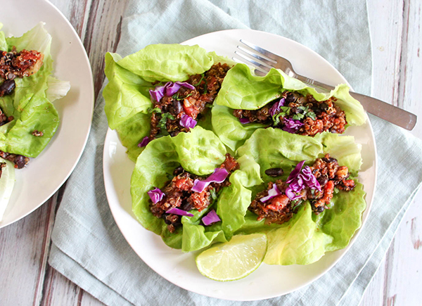 an overhead view of taco lettuce wraps on a white plate