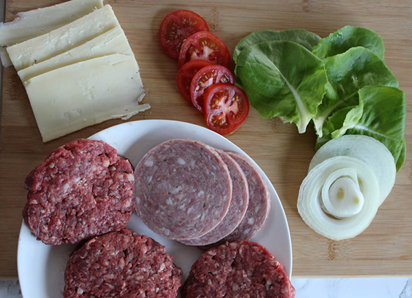 the ingredients: burgers, pork roll, tomatoes, lettuce, onion, cheese