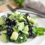 summer cucumber salad on a white plate