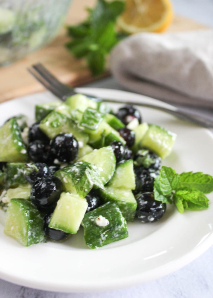 summer cucumber salad on a white plate