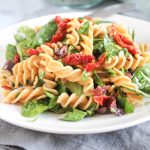 pasta sald on a plate with a fork