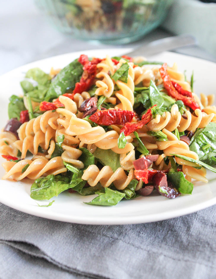 pasta sald on a plate with a fork