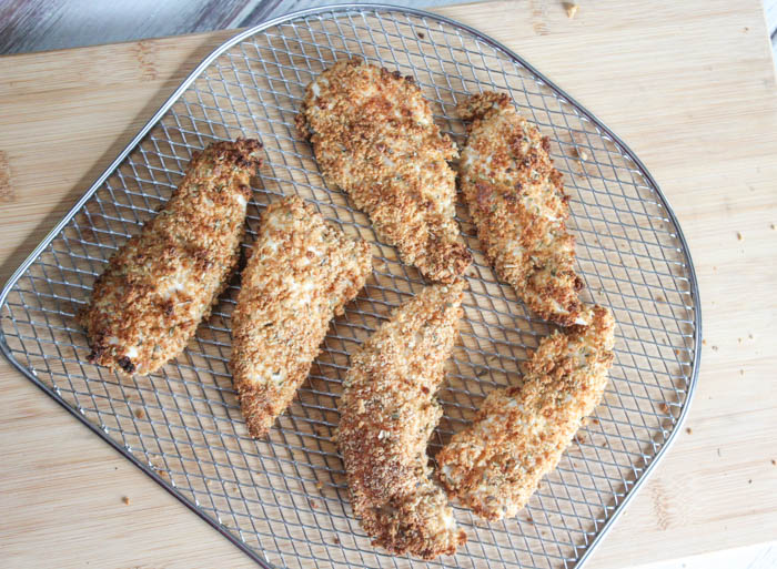 a picture of chicken tenders on an air fryer tray