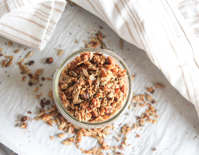 an overhead shot of granola in a jar