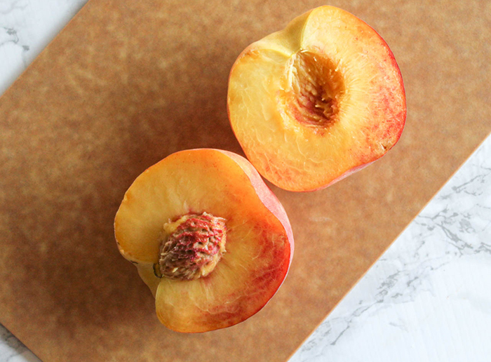 a picture of a peach sliced in half