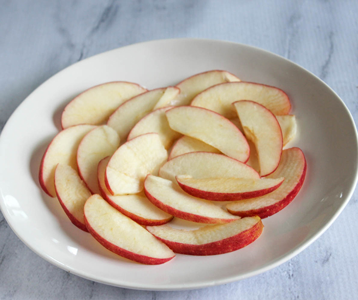 sliced apples on a white plate