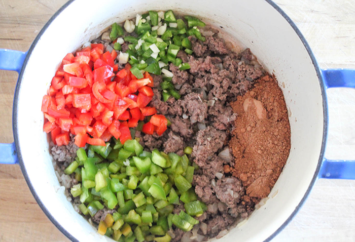 bison, peppers and spices in a pot