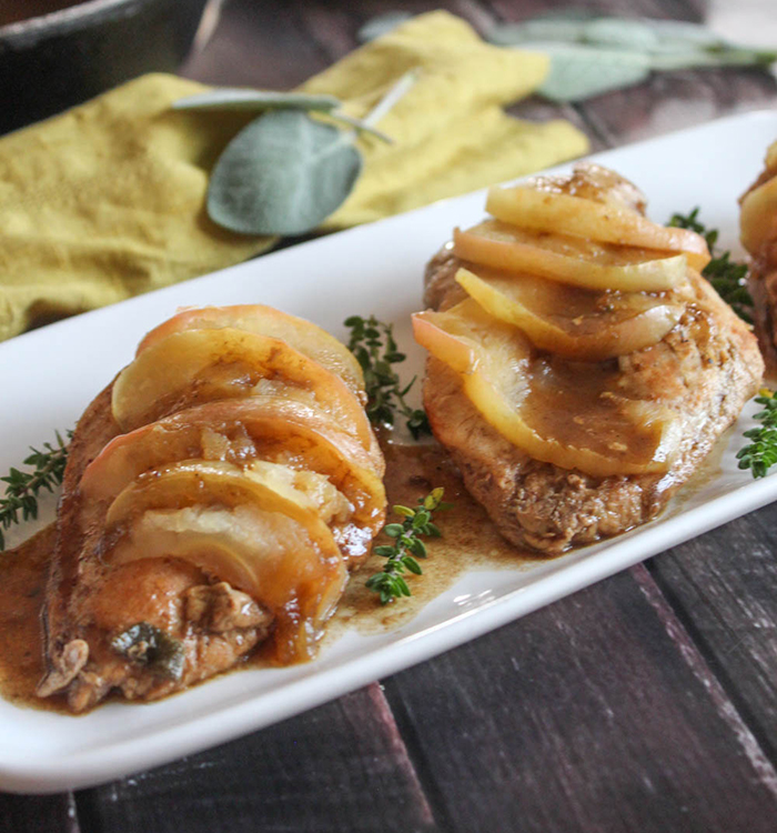 baked chicken cutlets with sliced apples on top