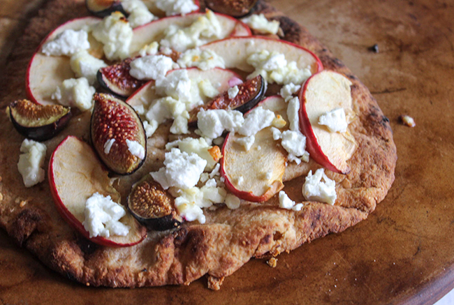 a picture of apples, figs and goat cheese on a flatbread