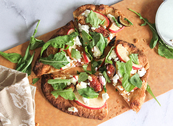 An overhead view of the flatbread  cut into four pieces