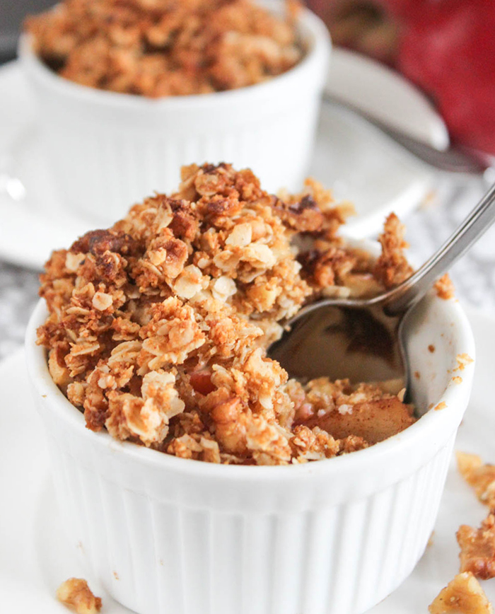 A close up of apple crisp with a spoon