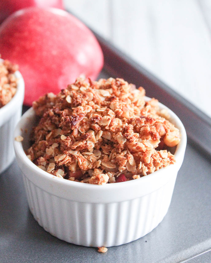 a ramekin filled with apple crisp
