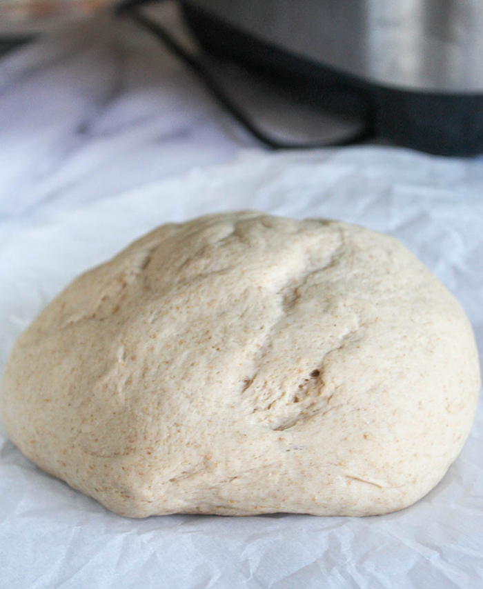 a dough ball on parchment paper