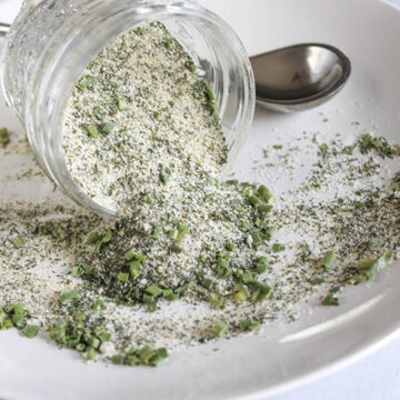 ranch season pouring out of a jar onto a white plate