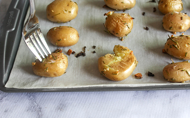 a for piercing potatoes on a baking sheet