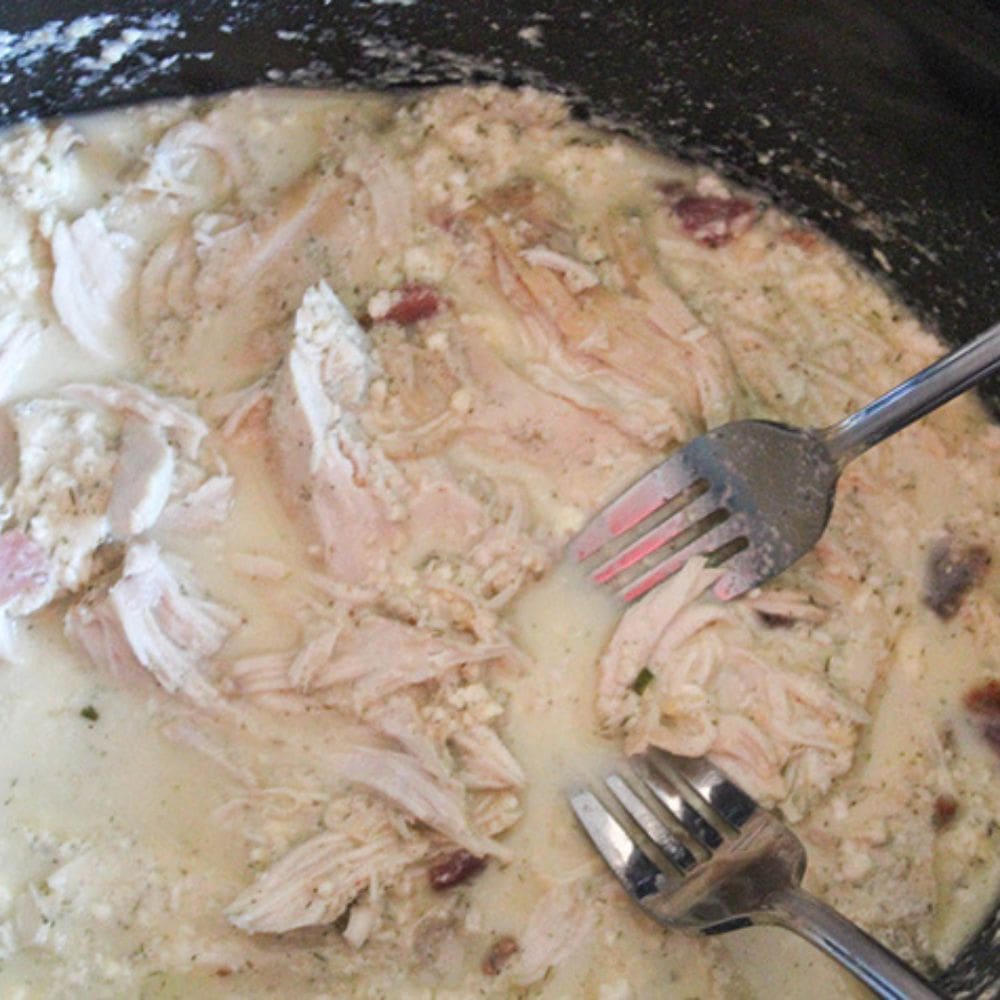 crack chicken process step 4,  2 forks shredding chicken