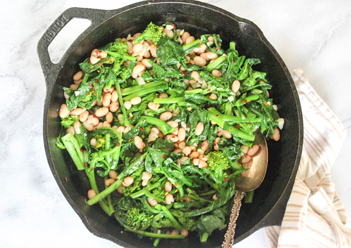 broccoli rabe and beans in a skillet