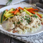 crack chicken on a plate with carrots and zucchini