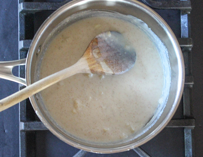 cream sauce in a pot on top of the stove