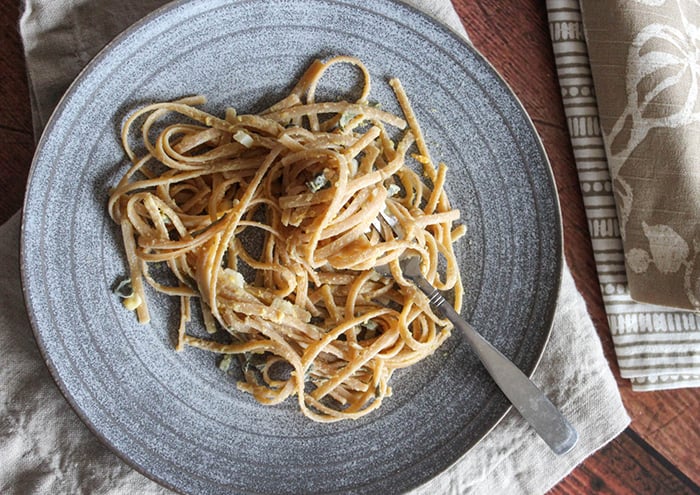 an overhead view of pumpkin sage pasta sauce on a plate