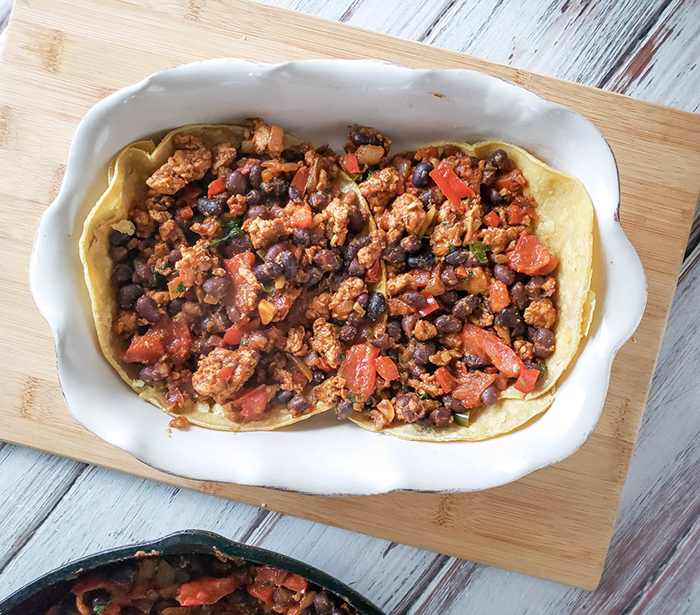 an overhead view of chicken mixture in a casserole dish 