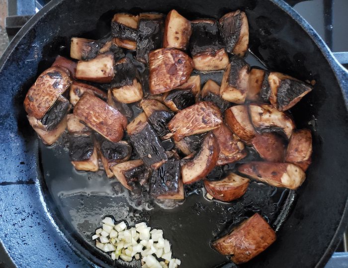 Mushrooms and garlic in a skillet