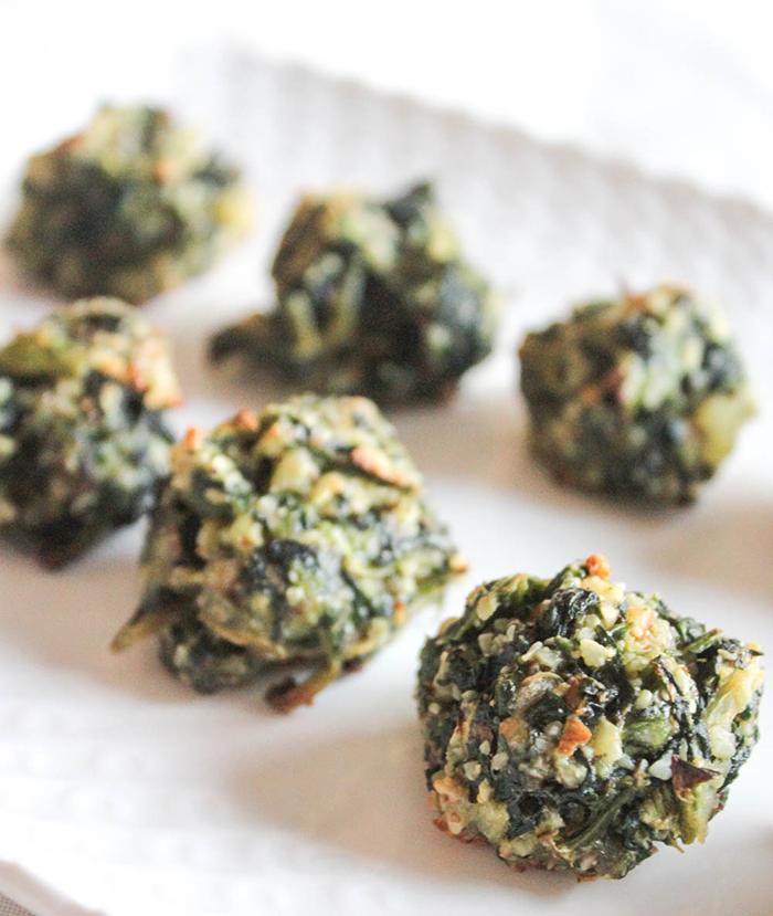 spinach balls on a white plate
