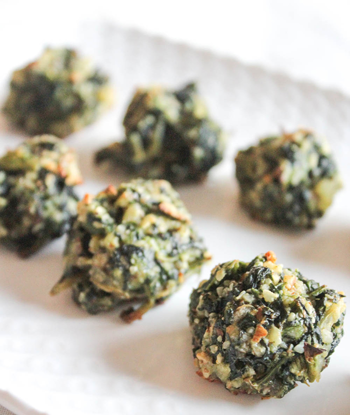 baked spinach balls on a tray