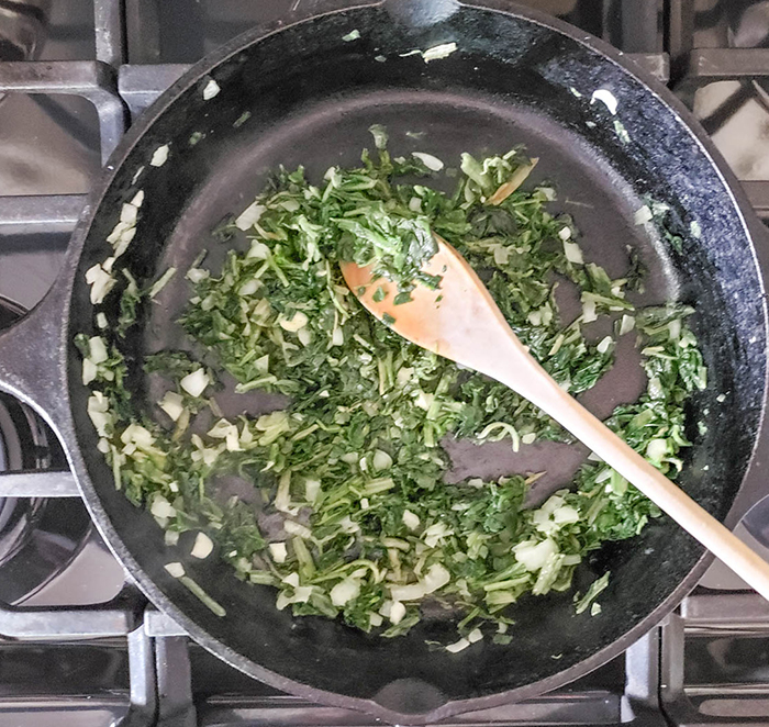 spinach cooking in a skillet