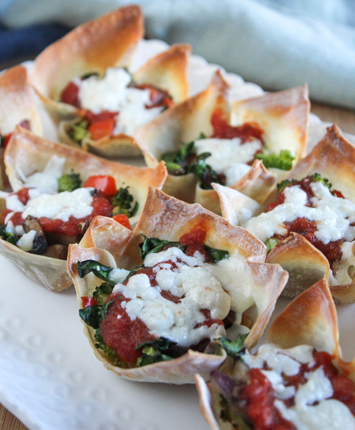 wonton pizza cups on a white plate