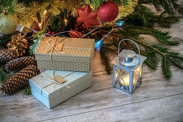 a photo of gift boxes under a christmas tree