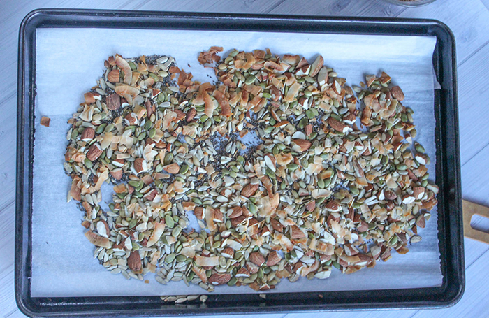 toasted nuts and seeds on a baking sheet