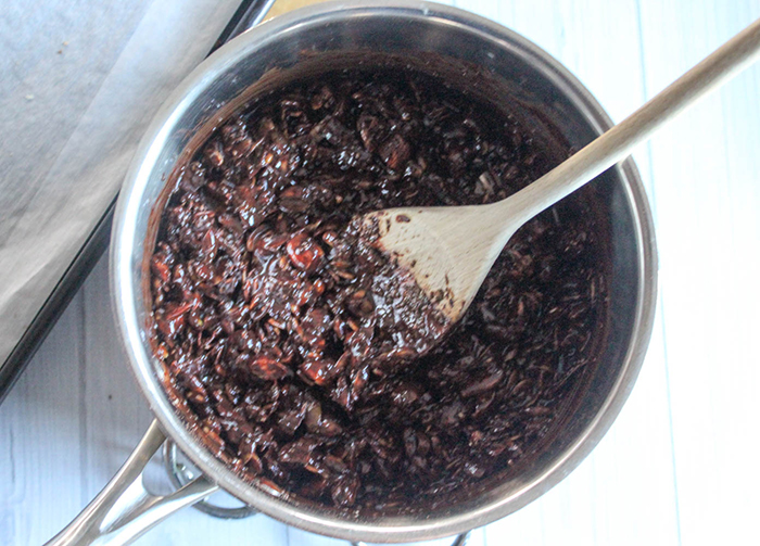 nuts and seeds mixed into the chocolate in the pan